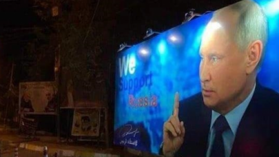 Bağdadda Putinin şəkli olan plakat söküldü